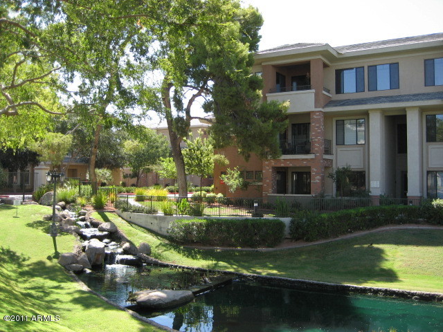 4488 East Thomas Road, Unit 1044 Phoenix, AZ 85018 - Photo 1 of 31 a view of swimming pool with lawn chairs and plants