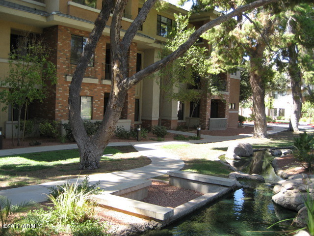 4488 East Thomas Road, Unit 1044 Phoenix, AZ 85018 - Photo 12 of 31 a street view with tall buildings