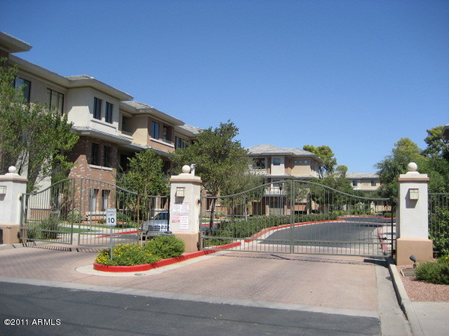 4488 East Thomas Road, Unit 1044 Phoenix, AZ 85018 - Photo 15 of 31 a view of a building with a street