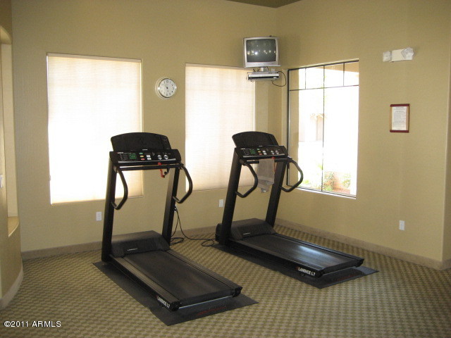 4488 East Thomas Road, Unit 1044 Phoenix, AZ 85018 - Photo 18 of 31 a room with gym equipment and a window