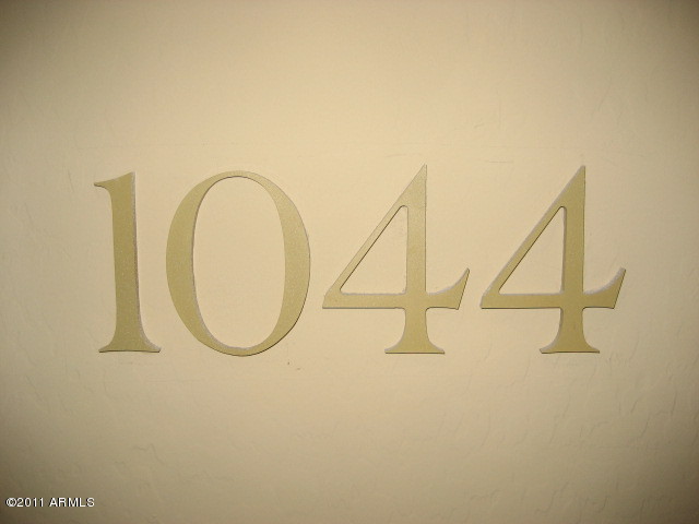 4488 East Thomas Road, Unit 1044 Phoenix, AZ 85018 - Photo 19 of 31 a view of a room with racks on the wall