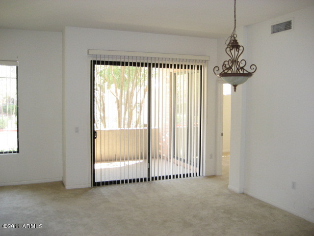 4488 East Thomas Road, Unit 1044 Phoenix, AZ 85018 - Photo 20 of 31 a view of a room with sliding windows