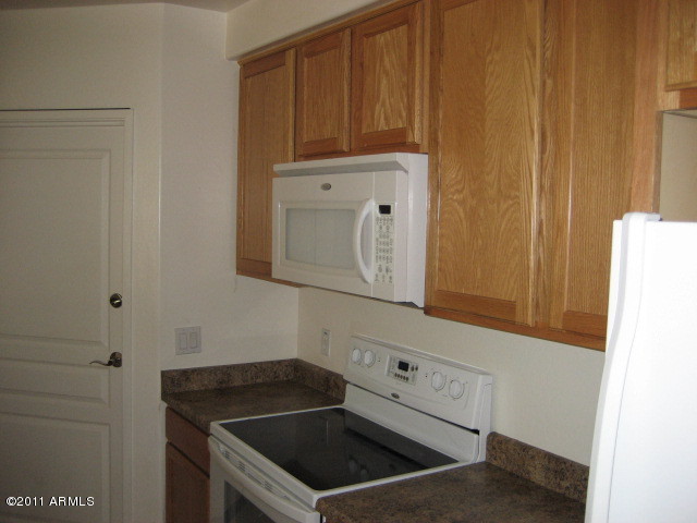 4488 East Thomas Road, Unit 1044 Phoenix, AZ 85018 - Photo 23 of 31 a bathroom with a sink and a mirror