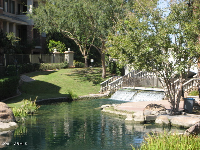 4488 East Thomas Road, Unit 1044 Phoenix, AZ 85018 - Photo 4 of 31 a view of a lake with houses