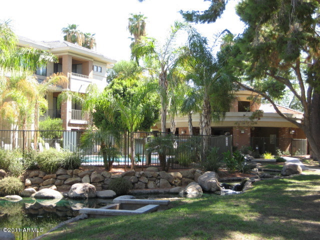 4488 East Thomas Road, Unit 1044 Phoenix, AZ 85018 - Photo 7 of 31 a front view of a house with garden