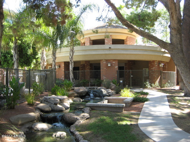 4488 East Thomas Road, Unit 1044 Phoenix, AZ 85018 - Photo 9 of 31 a front view of a house with garden and patio