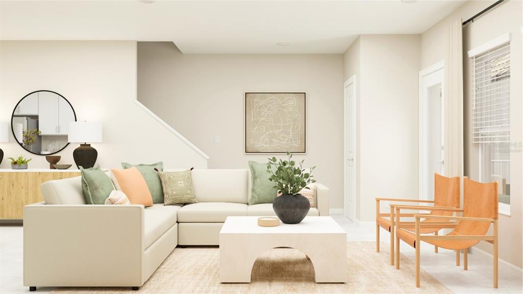 10262 Hadley Street Orlando, FL 32829 - Photo 9 of 19 a living room with furniture and a potted plant