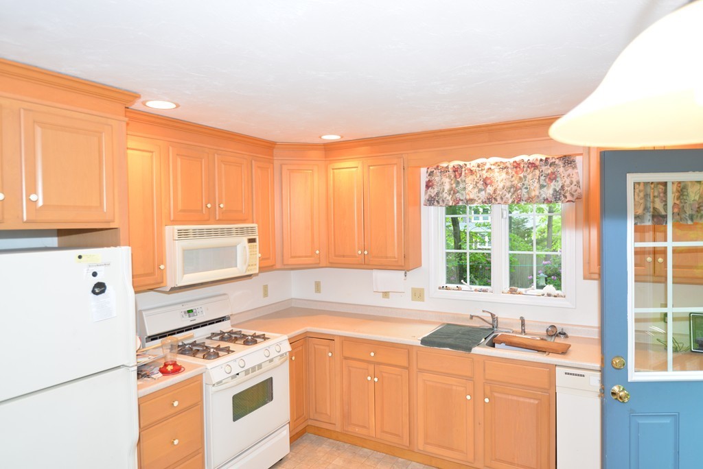 79 Converse Road Marion, MA 02738 - Photo 5 of 13 a kitchen with stainless steel appliances granite countertop a stove a sink and a refrigerator