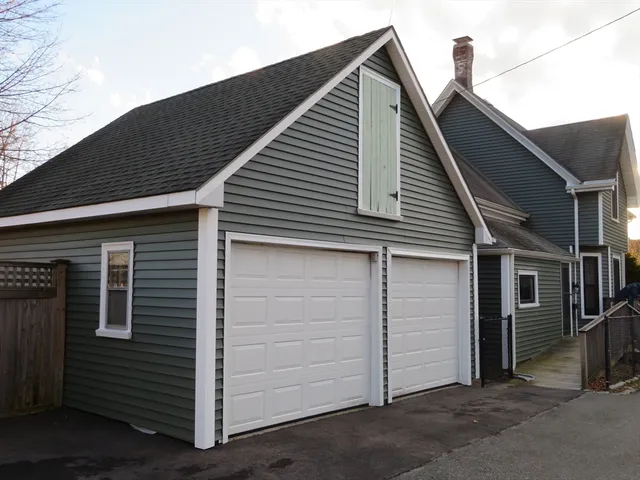 a view of house with garage