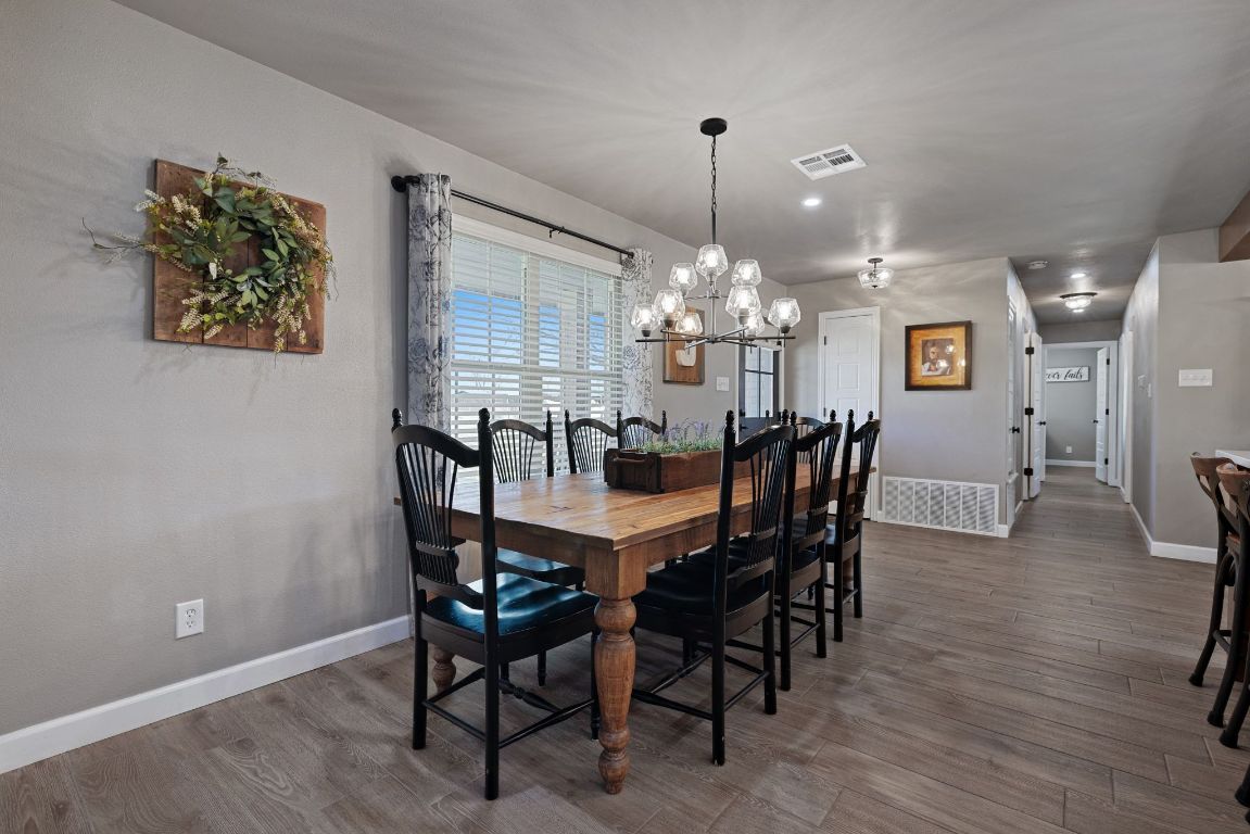301 North 8th Street Jarrell, TX 76537 - Photo 15 of 27 a view of a dining room with furniture and chandelier