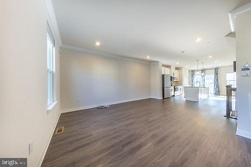 272 Sugar Maple Square Downingtown, PA 19335 - Photo 18 of 41 a view of a big room with wooden floor and a kitchen