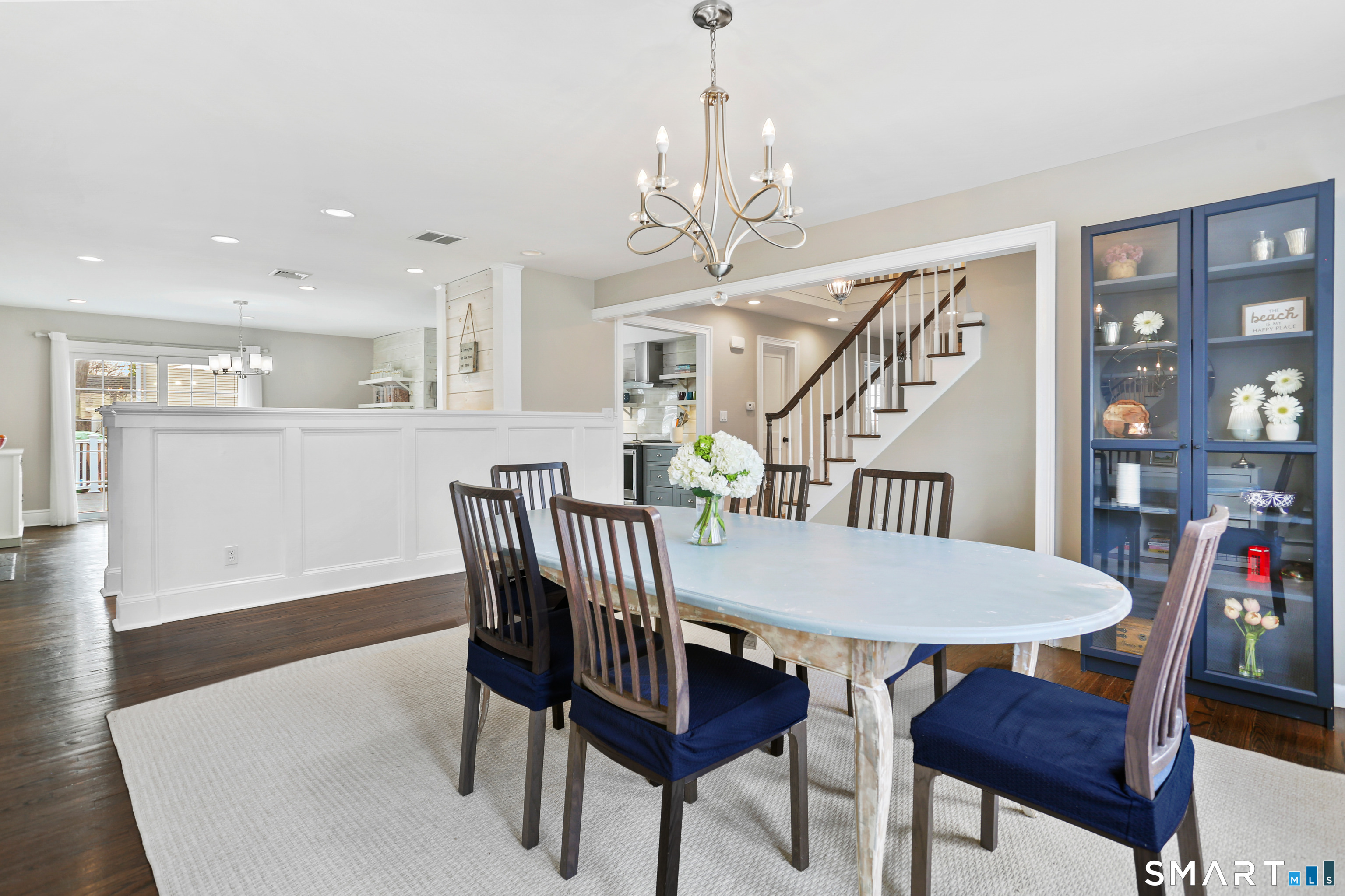 185 Windsor Road Fairfield, CT 06824 - Photo 12 of 41 a view of a dining room with furniture and wooden floor