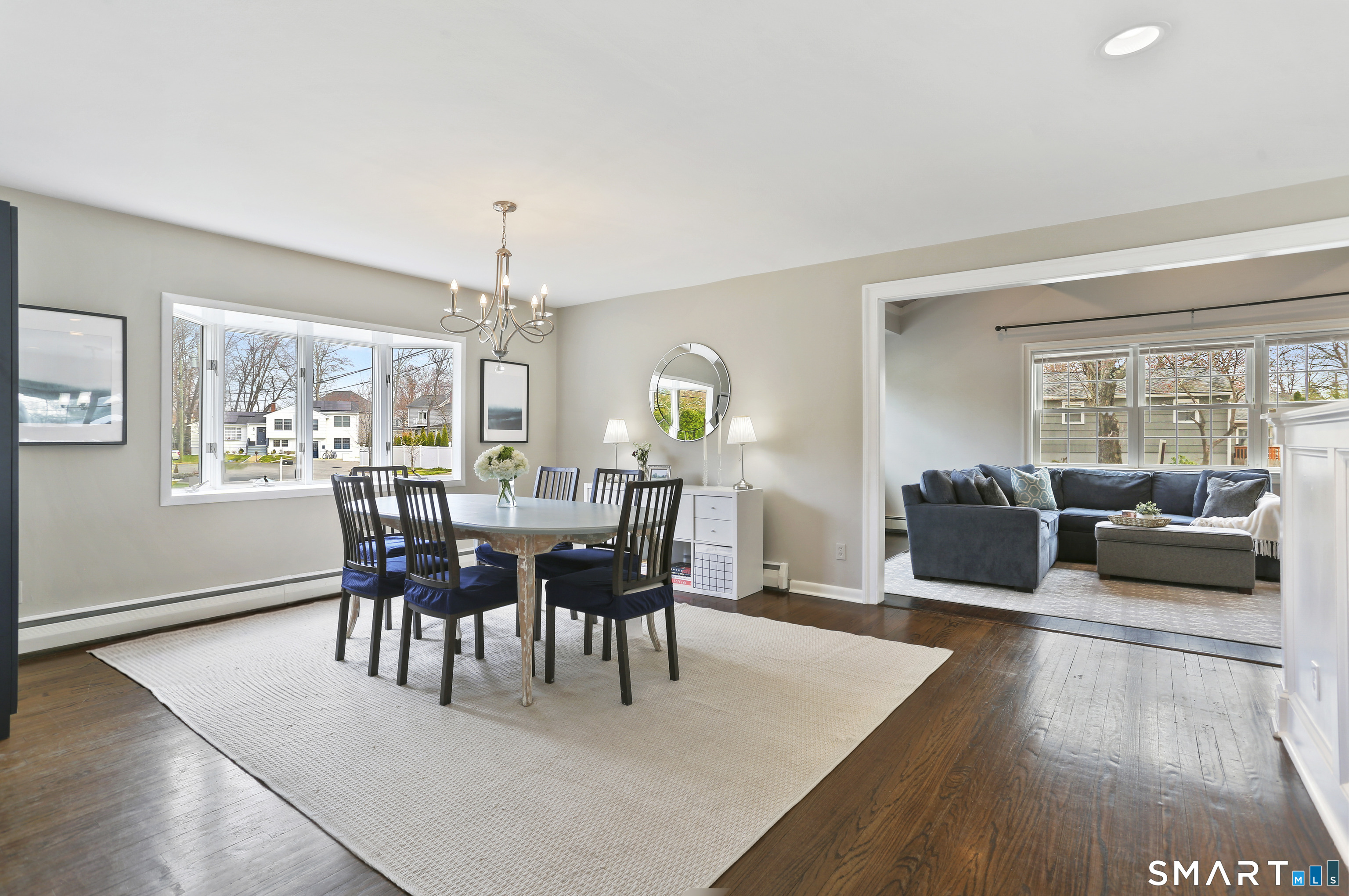 185 Windsor Road Fairfield, CT 06824 - Photo 13 of 41 a view of a dining room with furniture window and wooden floor