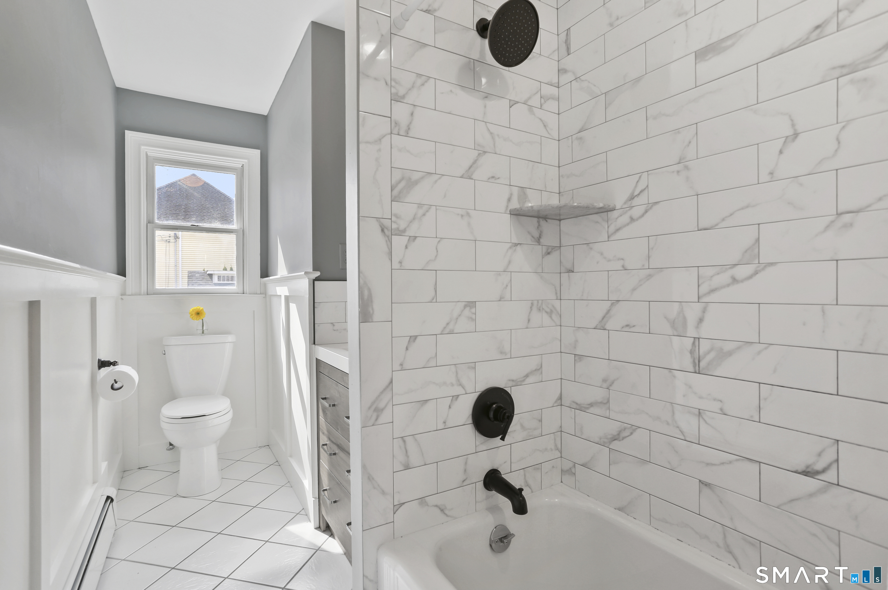 185 Windsor Road Fairfield, CT 06824 - Photo 19 of 41 a bathroom with a sink and a toilet