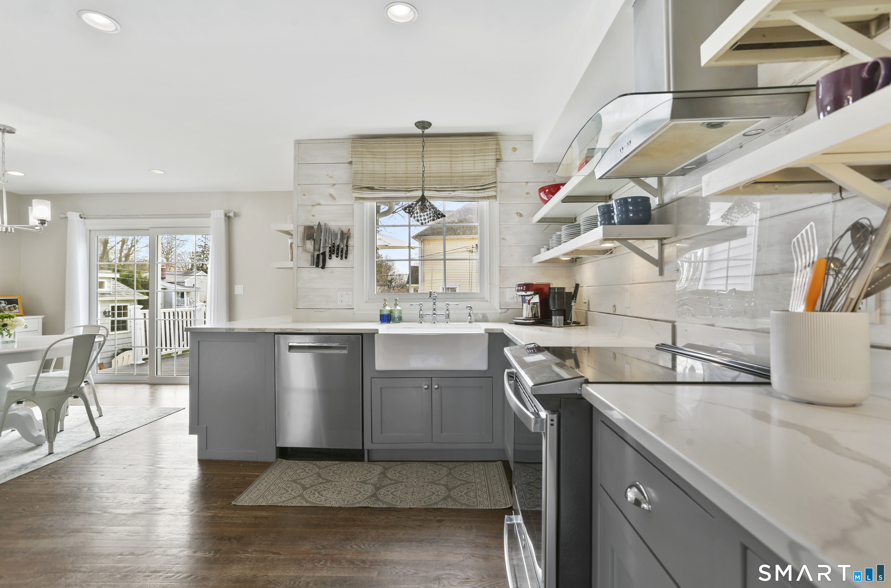 185 Windsor Road Fairfield, CT 06824 - Photo 4 of 41 a kitchen with cabinets and wooden floor
