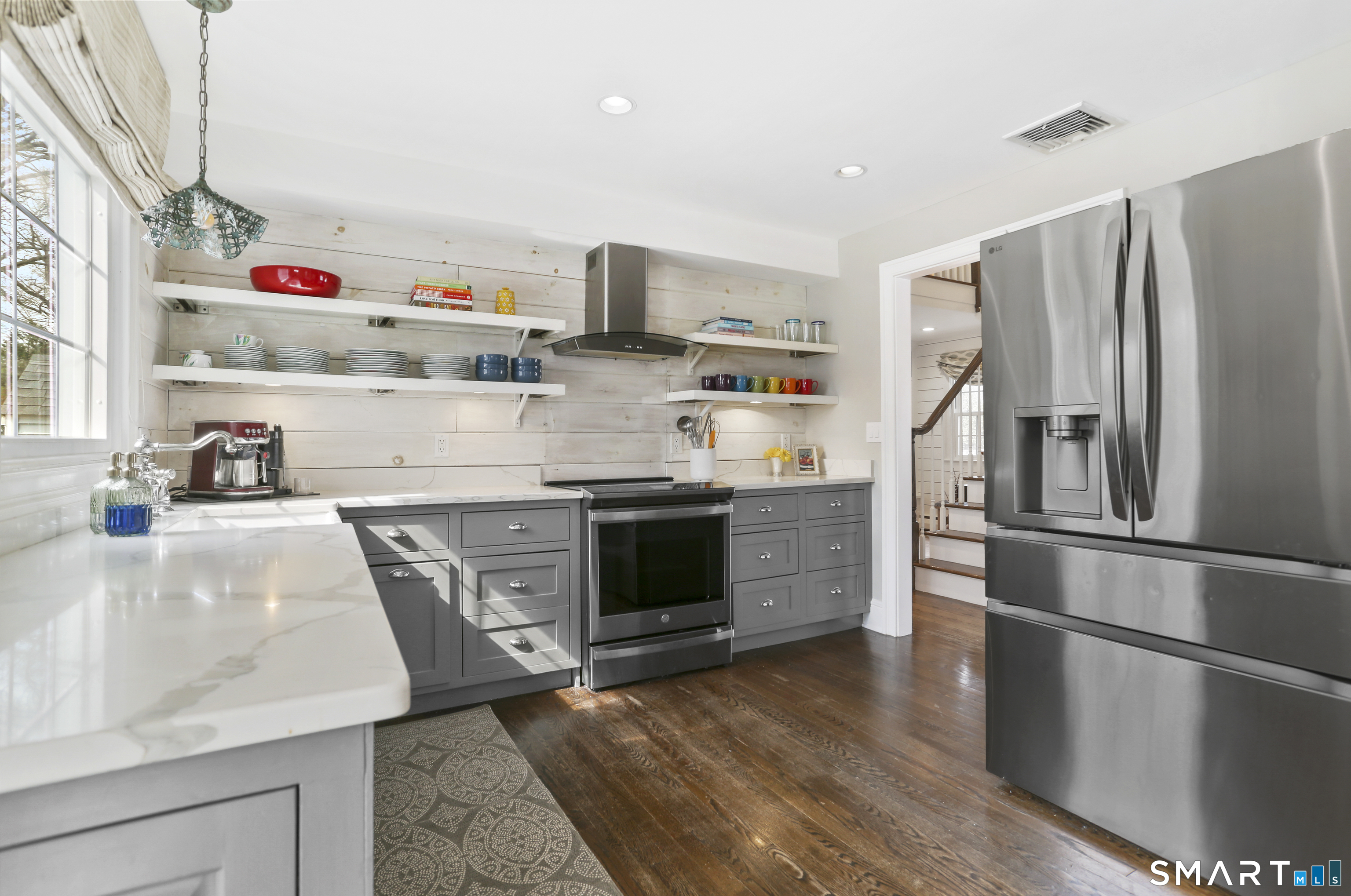 185 Windsor Road Fairfield, CT 06824 - Photo 6 of 41 a kitchen with stainless steel appliances granite countertop a refrigerator and a sink