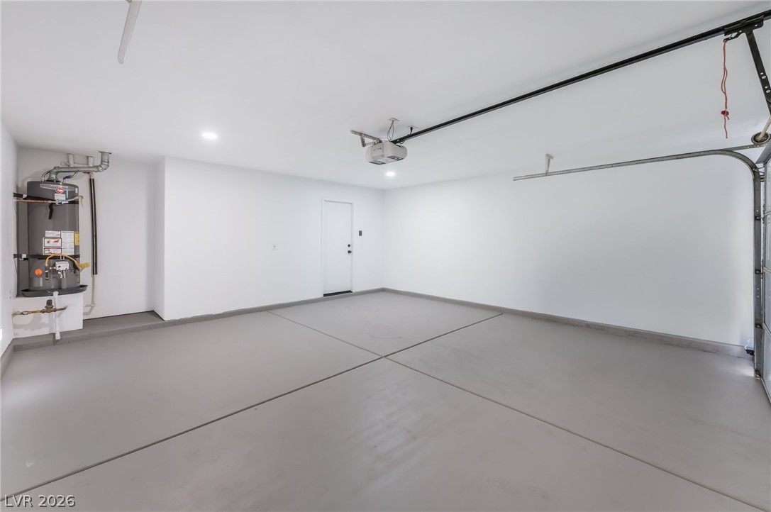 668 Rising Brook Drive Henderson, NV 89011 - Photo 18 of 22 A spacious, pristine garage features a smooth, durable concrete floor with fresh paint throughout.