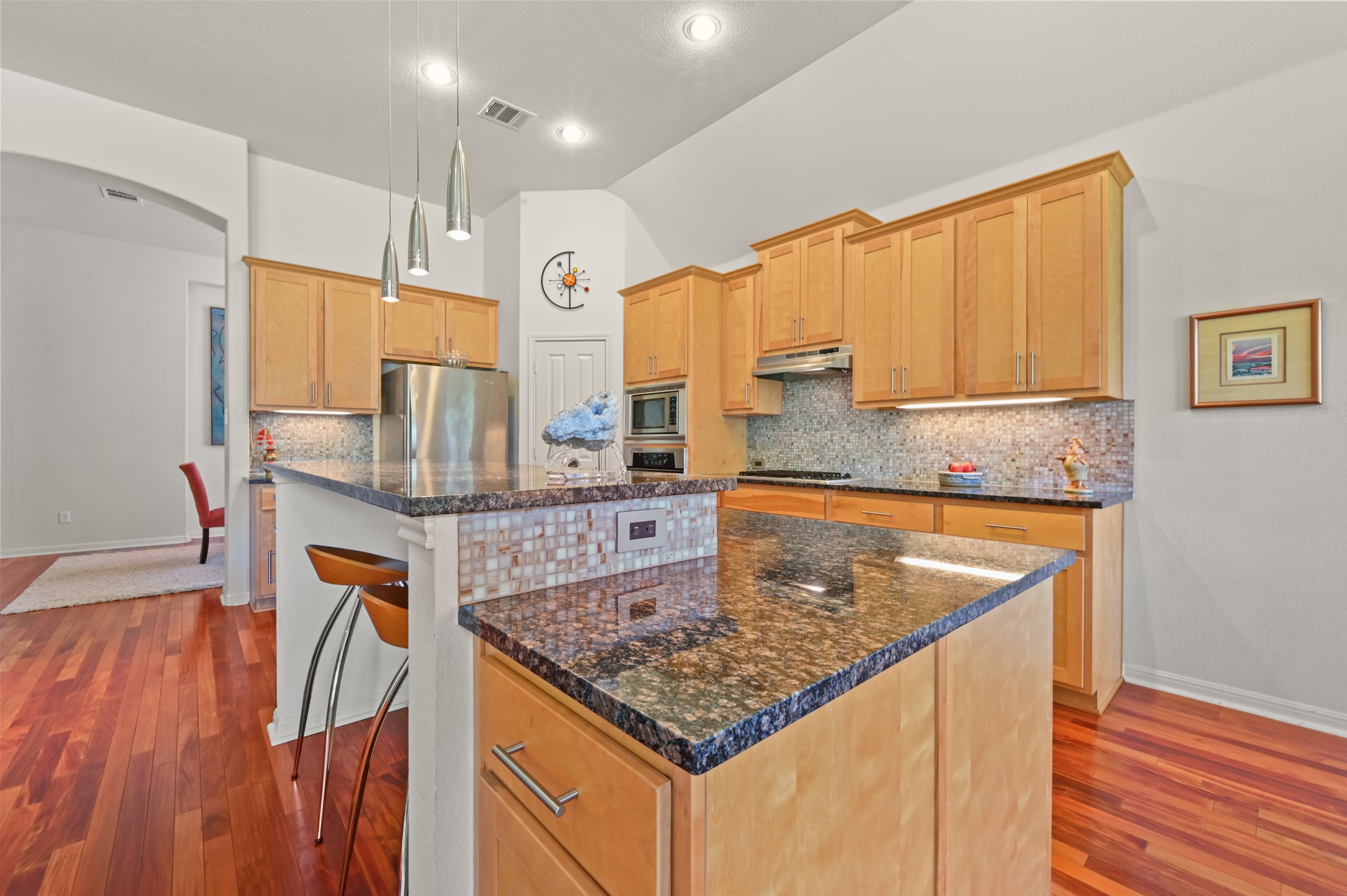 7301 Seneca Falls Loop Austin, TX 78739 - Photo 13 of 36 The kitchen has beautiful granite countertops and great island bar seating.