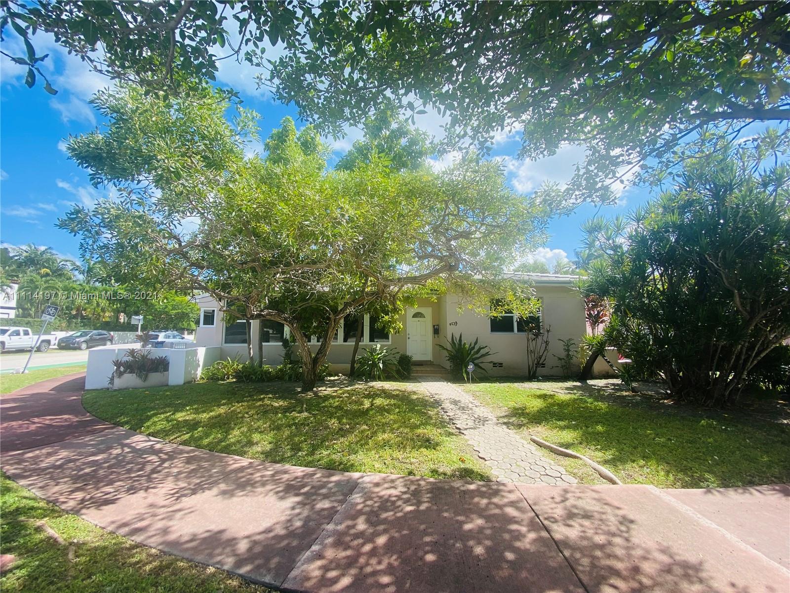 4635 Alton Road Miami Beach, FL 33140 - Photo 1 of 1 a view of a patio with a yard