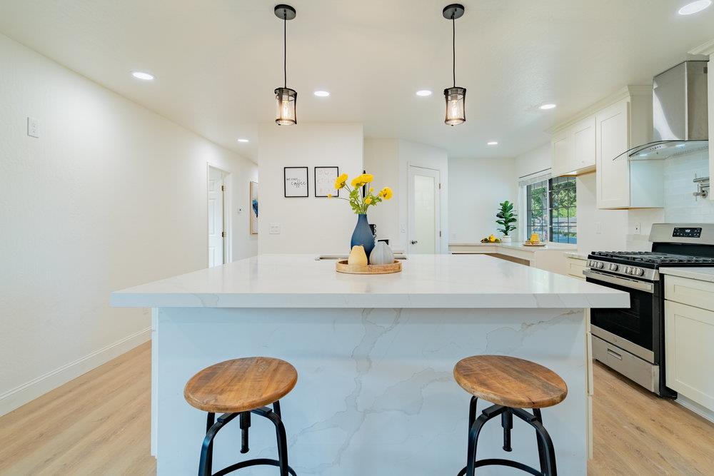 741 West 6th Street Gilroy, CA 95020 - Photo 13 of 29 a kitchen with a table and chairs in it