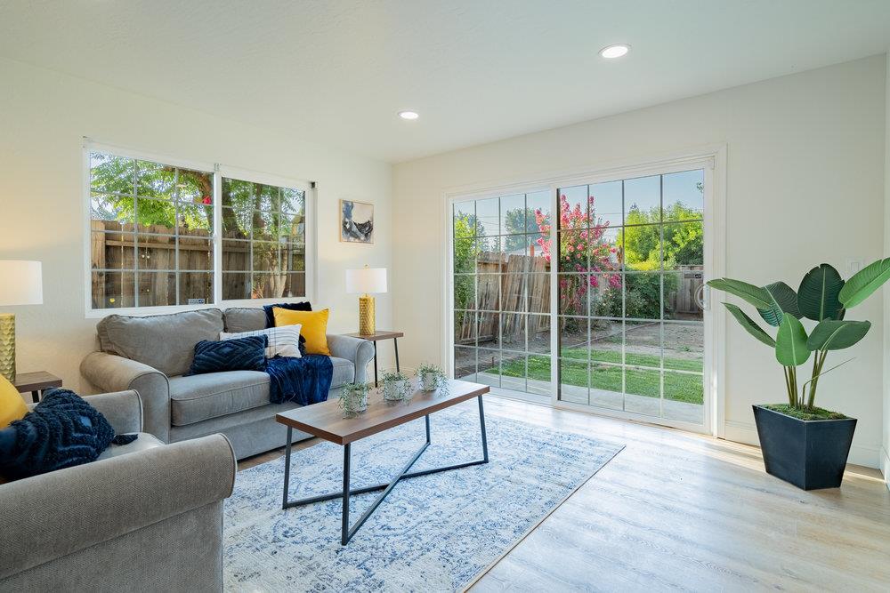 741 West 6th Street Gilroy, CA 95020 - Photo 16 of 29 a living room with furniture potted plant and a window