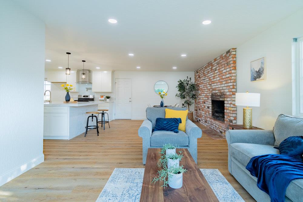741 West 6th Street Gilroy, CA 95020 - Photo 17 of 29 a living room with fireplace furniture and a wooden floor