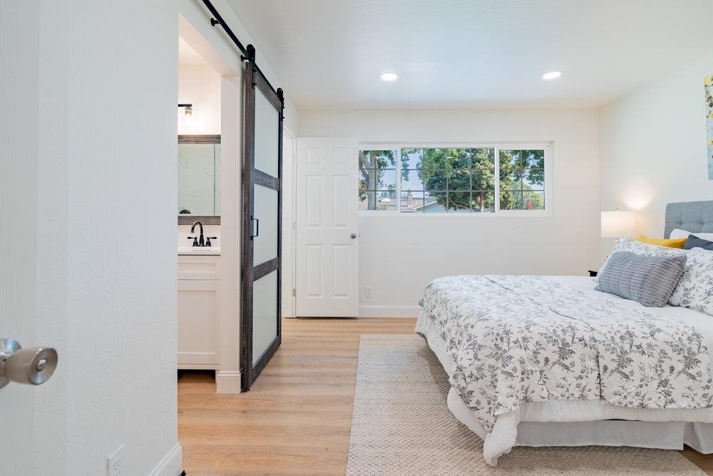 741 West 6th Street Gilroy, CA 95020 - Photo 21 of 29 a bedroom with a bed and a window