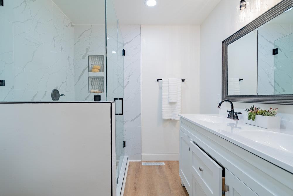 741 West 6th Street Gilroy, CA 95020 - Photo 22 of 29 a bathroom with a sink and a mirror