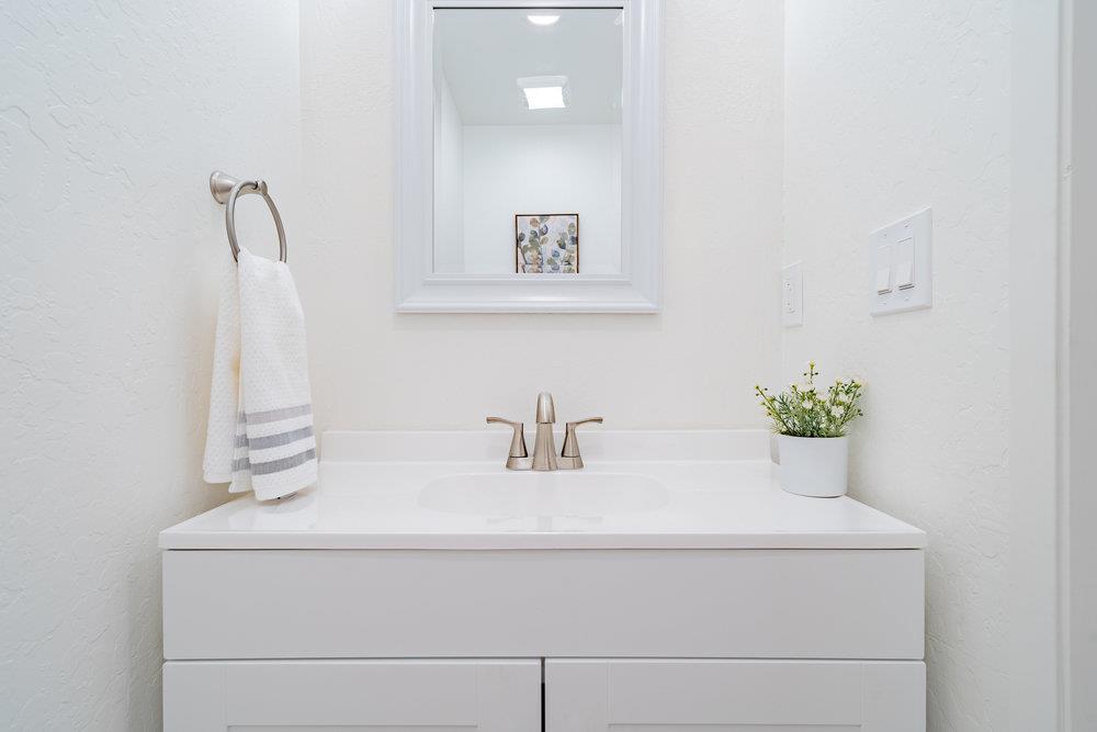 741 West 6th Street Gilroy, CA 95020 - Photo 25 of 29 a bathroom with a sink and a mirror