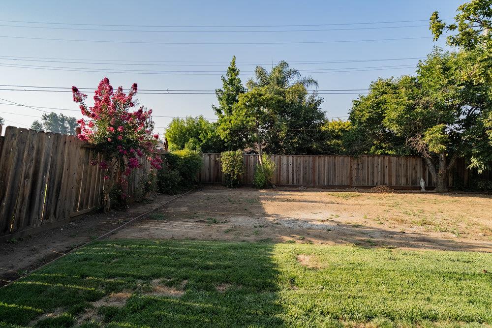 741 West 6th Street Gilroy, CA 95020 - Photo 26 of 29 a view of a backyard with a garden