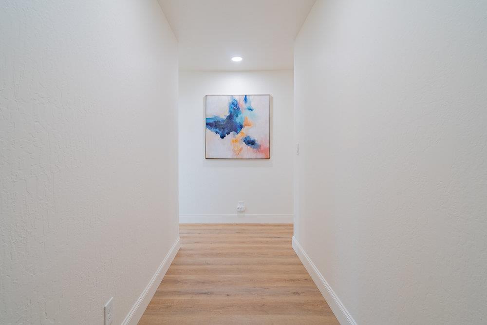 741 West 6th Street Gilroy, CA 95020 - Photo 7 of 29 a view of a hallway with wooden floor