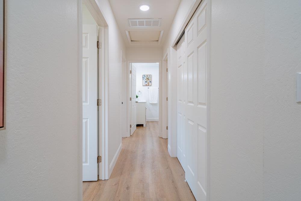741 West 6th Street Gilroy, CA 95020 - Photo 8 of 29 a view of a hallway with wooden floor