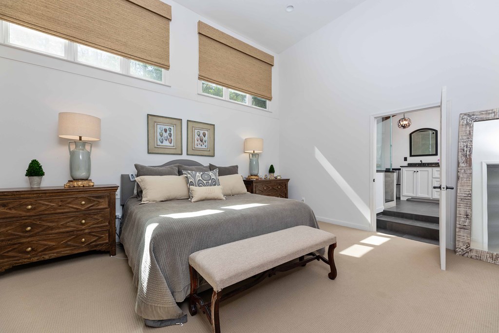 94 Hidden Trail Hamilton, GA 31811 - Photo 14 of 46 a bedroom with a bed and a lamp on the dresser