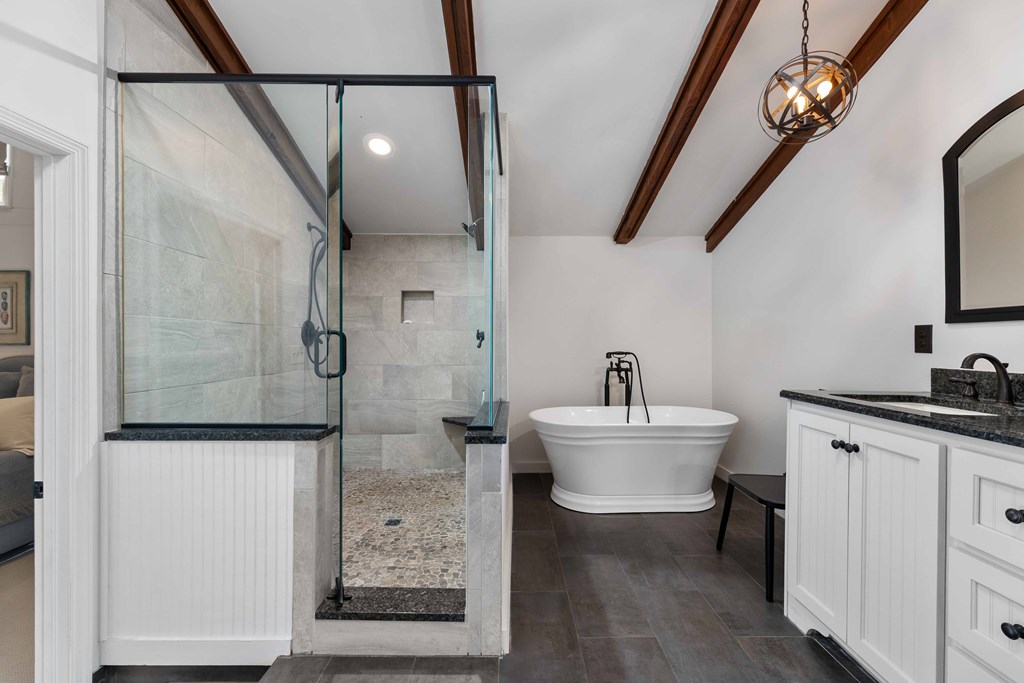 94 Hidden Trail Hamilton, GA 31811 - Photo 17 of 46 a bathroom with a sink a toilet a mirror and shower