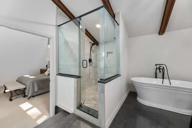 a room with a bed and a mirror