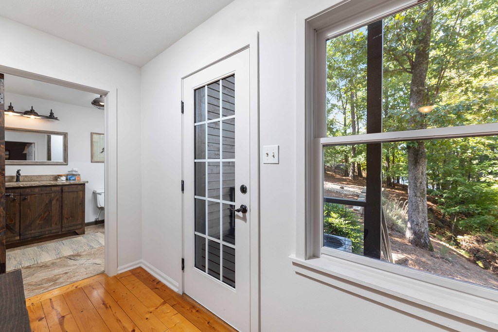 94 Hidden Trail Hamilton, GA 31811 - Photo 21 of 46 a view of a bedroom with a window and wooden floor
