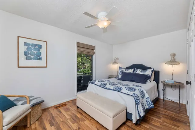 a bedroom with a bed and a table in it