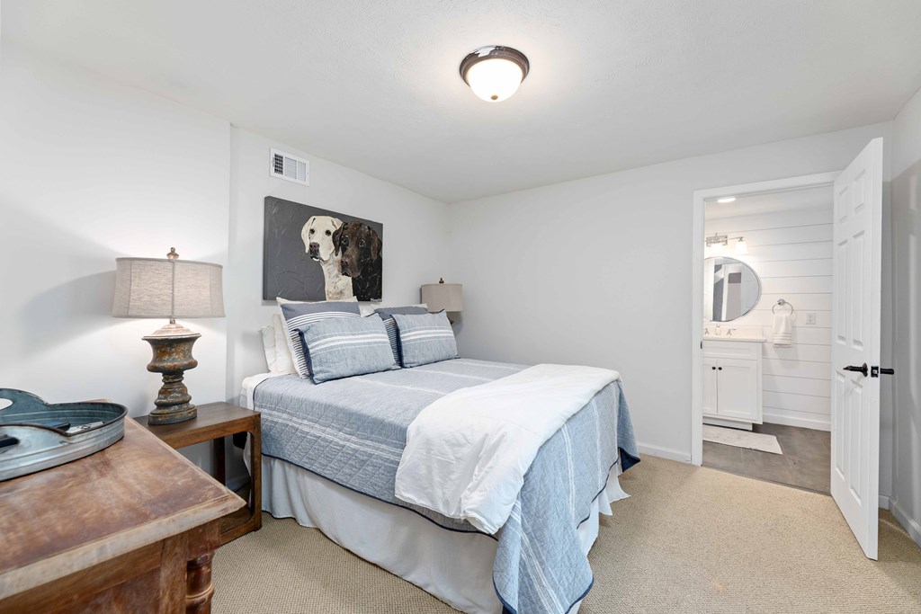 94 Hidden Trail Hamilton, GA 31811 - Photo 24 of 46 a bedroom with a bed and a table in it