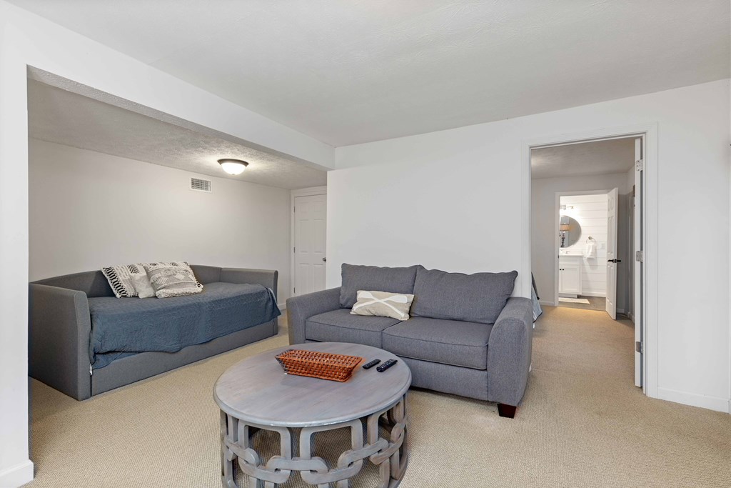 94 Hidden Trail Hamilton, GA 31811 - Photo 26 of 46 a living room with furniture and a table