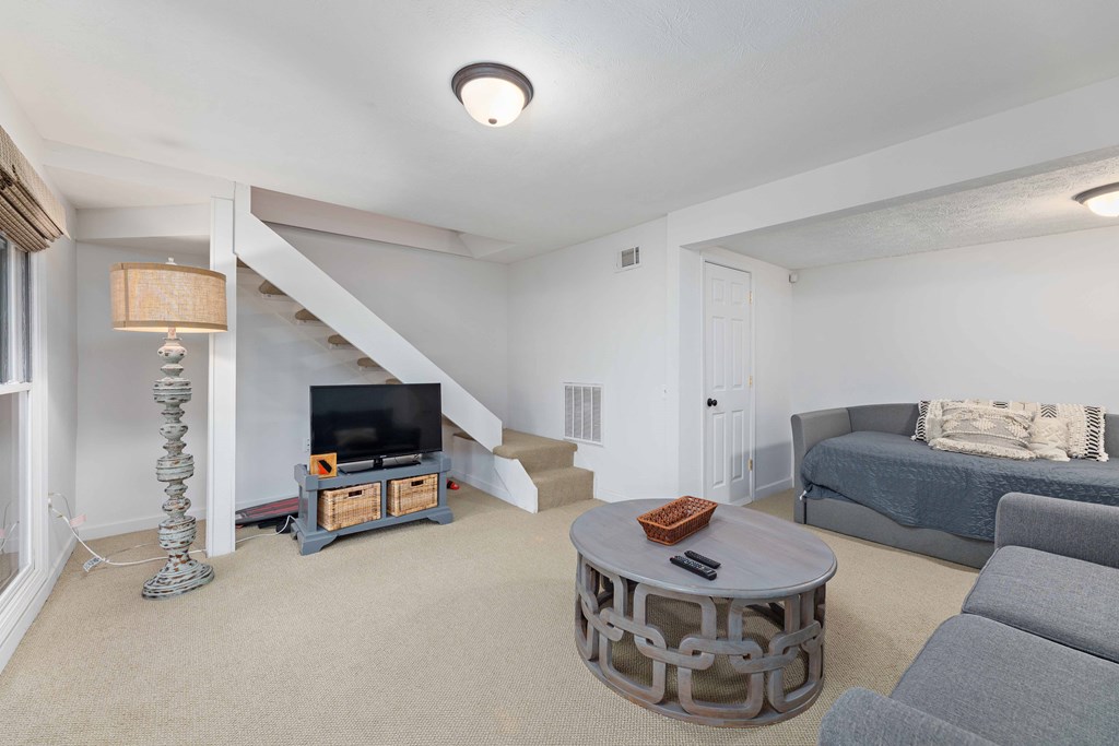 94 Hidden Trail Hamilton, GA 31811 - Photo 27 of 46 a living room with furniture and a flat screen tv