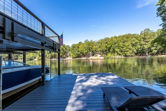a view of a lake with a house in the background