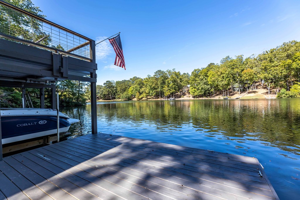 94 Hidden Trail Hamilton, GA 31811 - Photo 36 of 46 a view of a lake with a house in the background