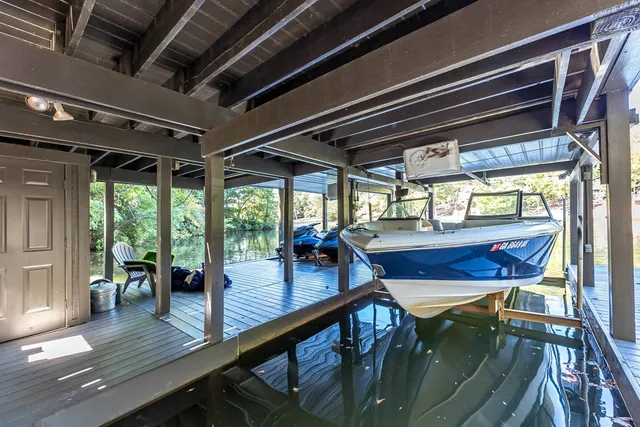 a view of a wooden deck and a backyard