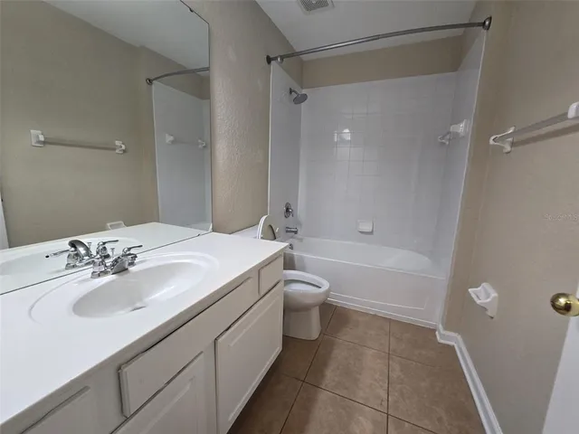 an empty room with a empty space and windows