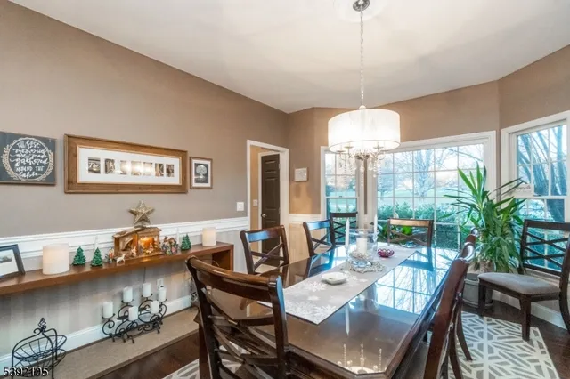 a dining room with furniture window and outdoor view