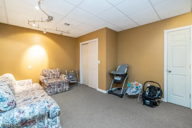 a bedroom with bed and a windows