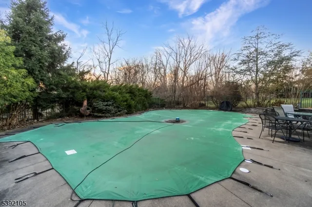 a view of a backyard with sitting area