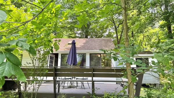 front view of a house with a tree