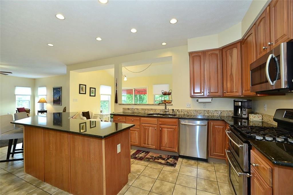 227 Field Club Circle McKees Rocks, PA 15136 - Photo 11 of 25 Kitchen - With Granite Counter Top, Angled CenterIsland, Stainless Steel Appliances