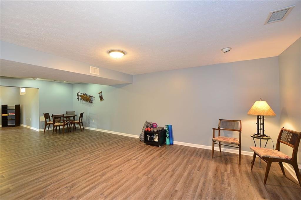 227 Field Club Circle McKees Rocks, PA 15136 - Photo 20 of 25 Lower Level Game Room - Spacious Area for PoolTable, Ping Pong Table, Exercise Equipment Leads intoAdditional Room Area that is 20x10.